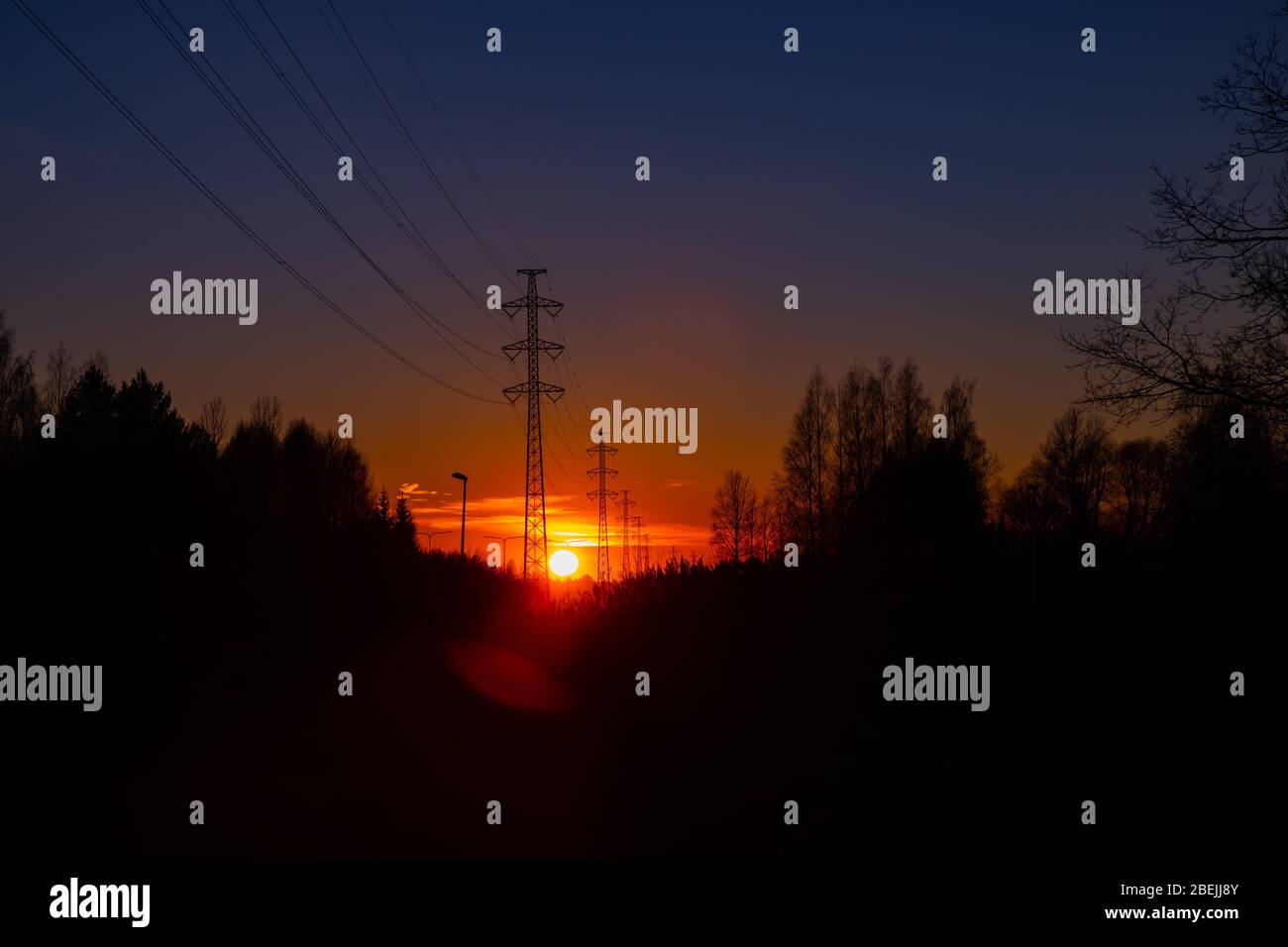 High voltage towers aganist the beautiful sunset Stock Photo - Alamy