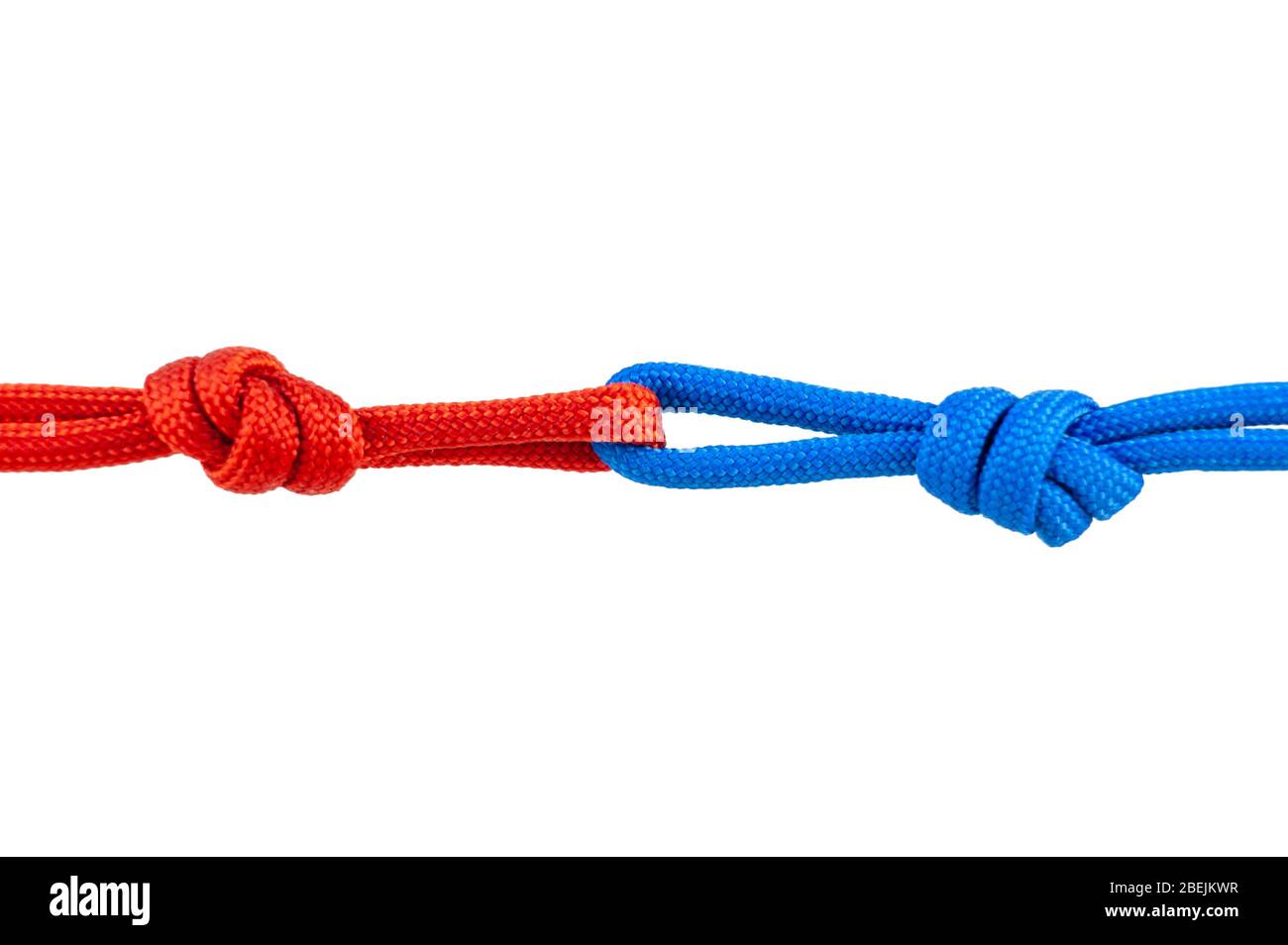 Two red and blue cords are connected . Knot on a cord isolated on a white background . Stock Photo