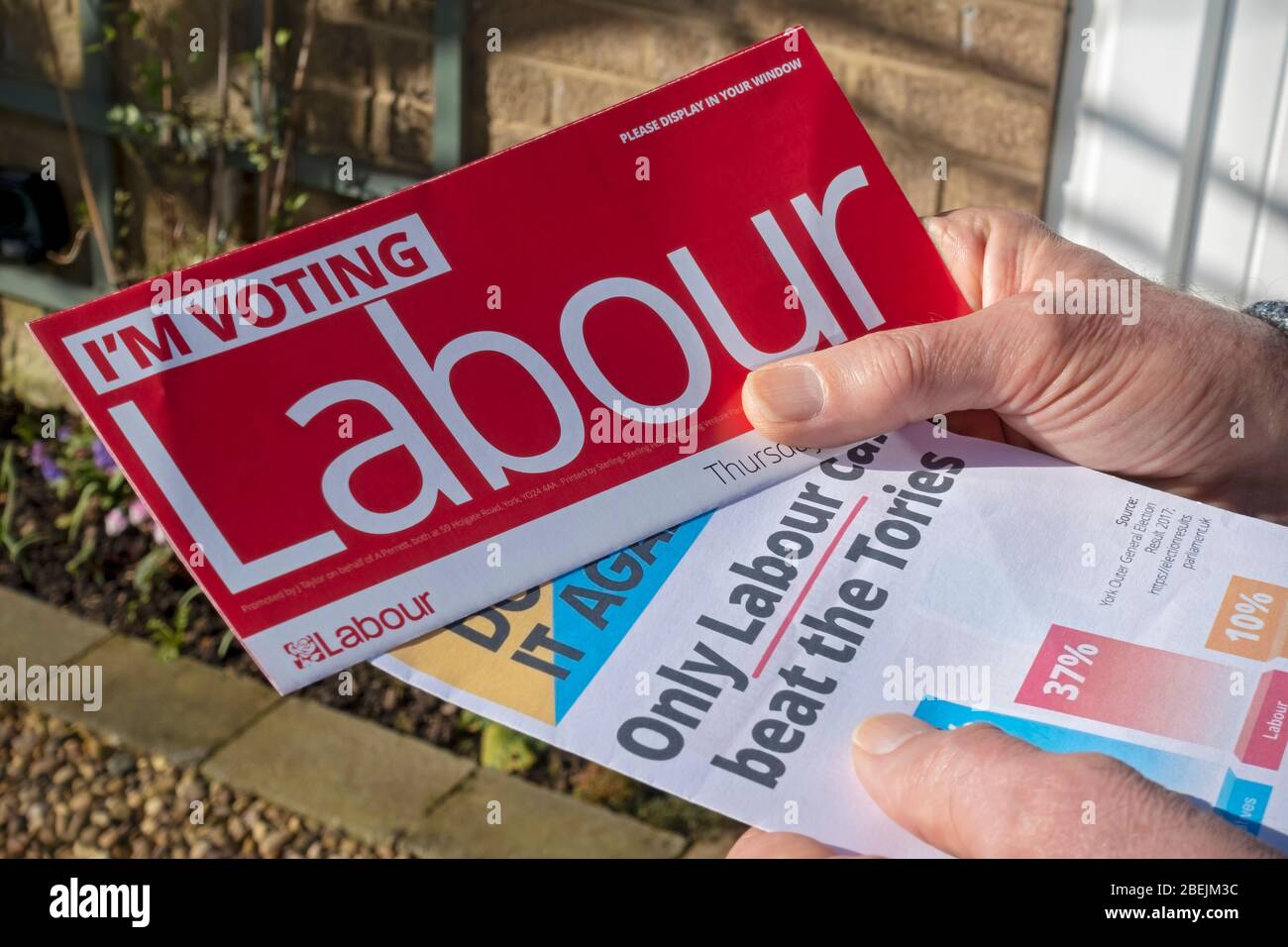 Close up of person man holding Labour Party General Election 2019 letter leaflets England UK United Kingdom GB Great Britain Stock Photo