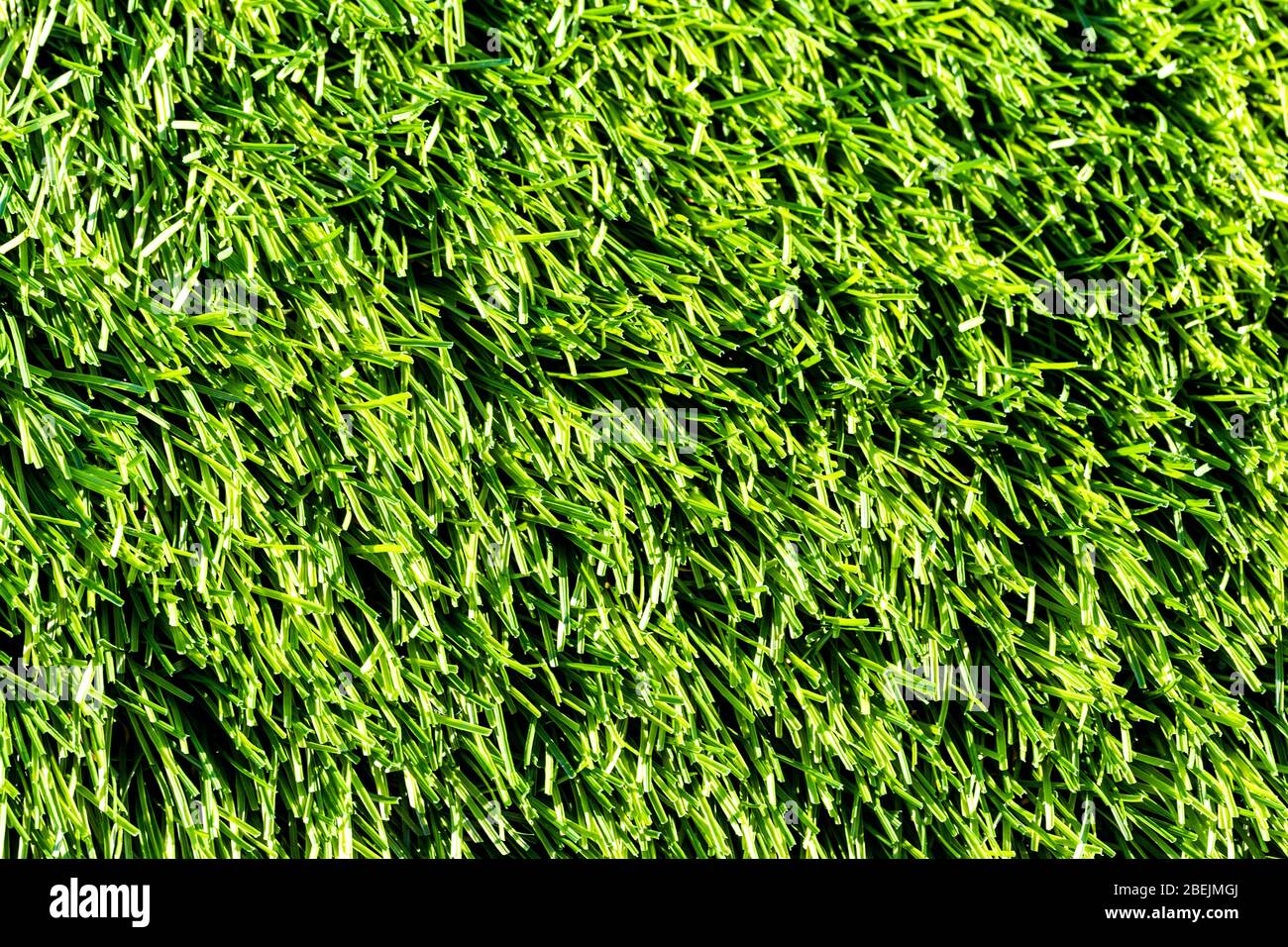 Artificial green grass or needles texture. Abstract backdrop for design. Stock Photo