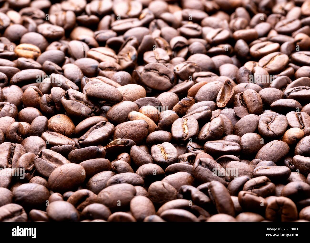 Roasted coffee beans background. Close-up. Selective focus Stock Photo