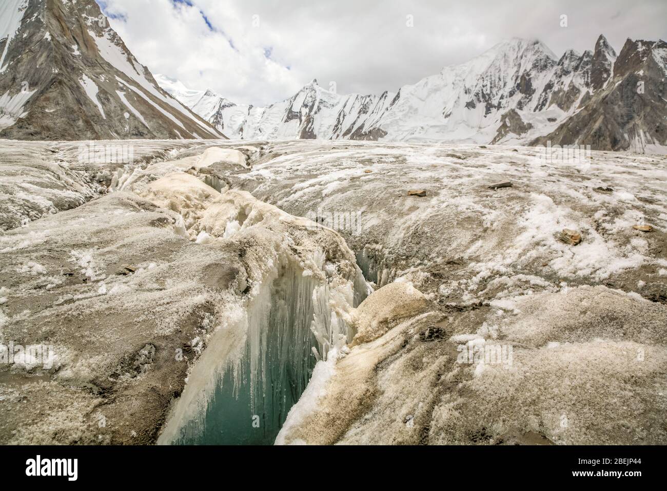 A deep crevasse on the Vigne Glacier in the Karakoram mountains of Northern Pakistan. Stock Photo