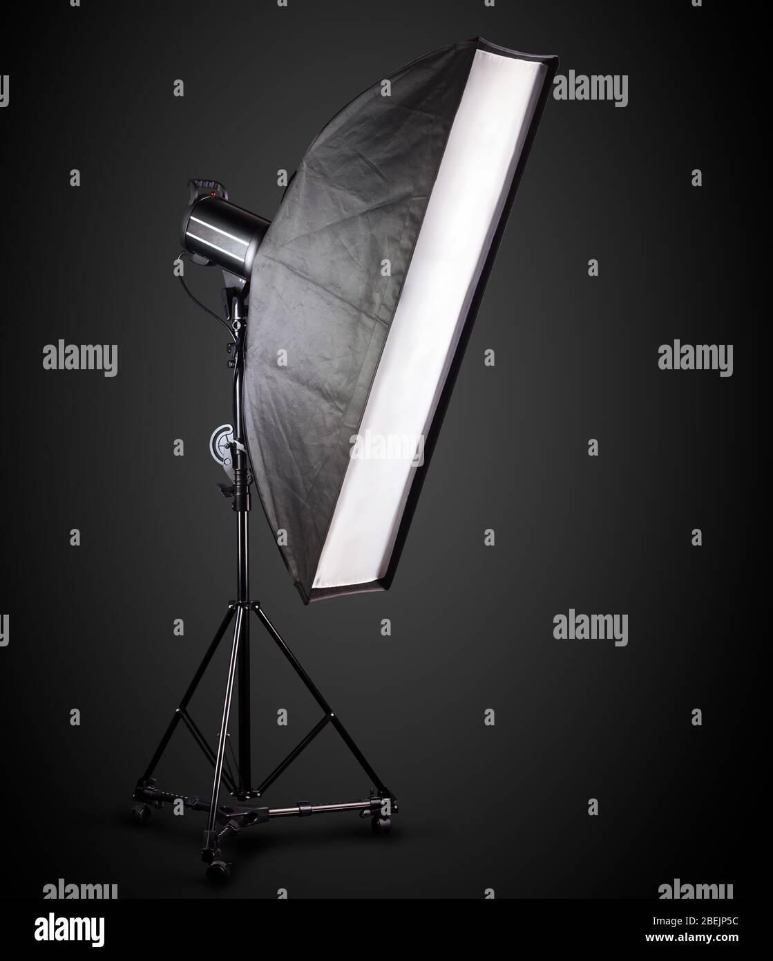 Photo studio lighting stands with flash and softbox isolated on the