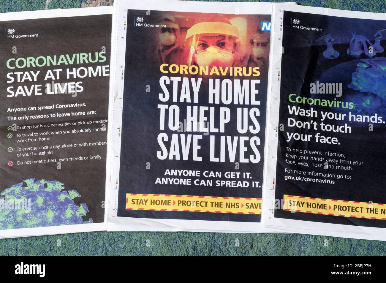 A selection of government newspaper advertisements encouraging people to stay at home during the 2020 Covid 19 Coronavirus pandemic. Stock Photo
