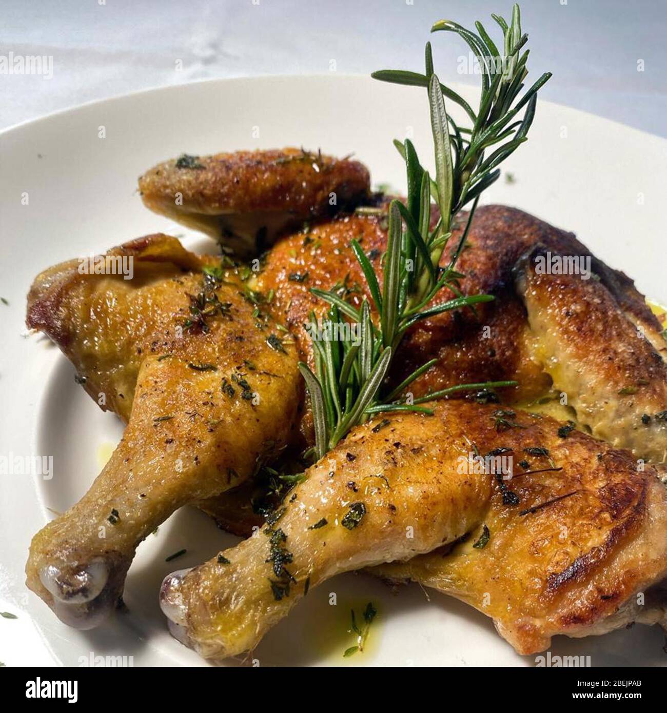 Milan, Italy. 10th Apr, 2020. Milan, 'Ghost Kitchen' Virtual restaurant with dishes delivered directly to the home. In the photo: brick cockerel Credit: Independent Photo Agency/Alamy Live News Stock Photo