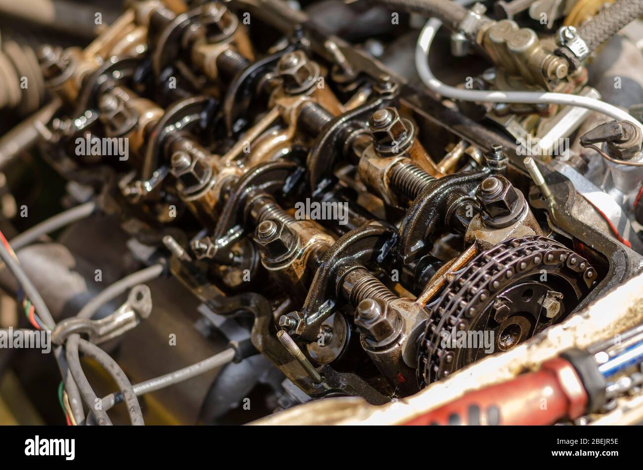 Disassembled four-stroke gasoline engine. Detailed shot of carburetor  engine without valve cover. Retro car repair. Side view. Selective focus.  Close Stock Photo - Alamy