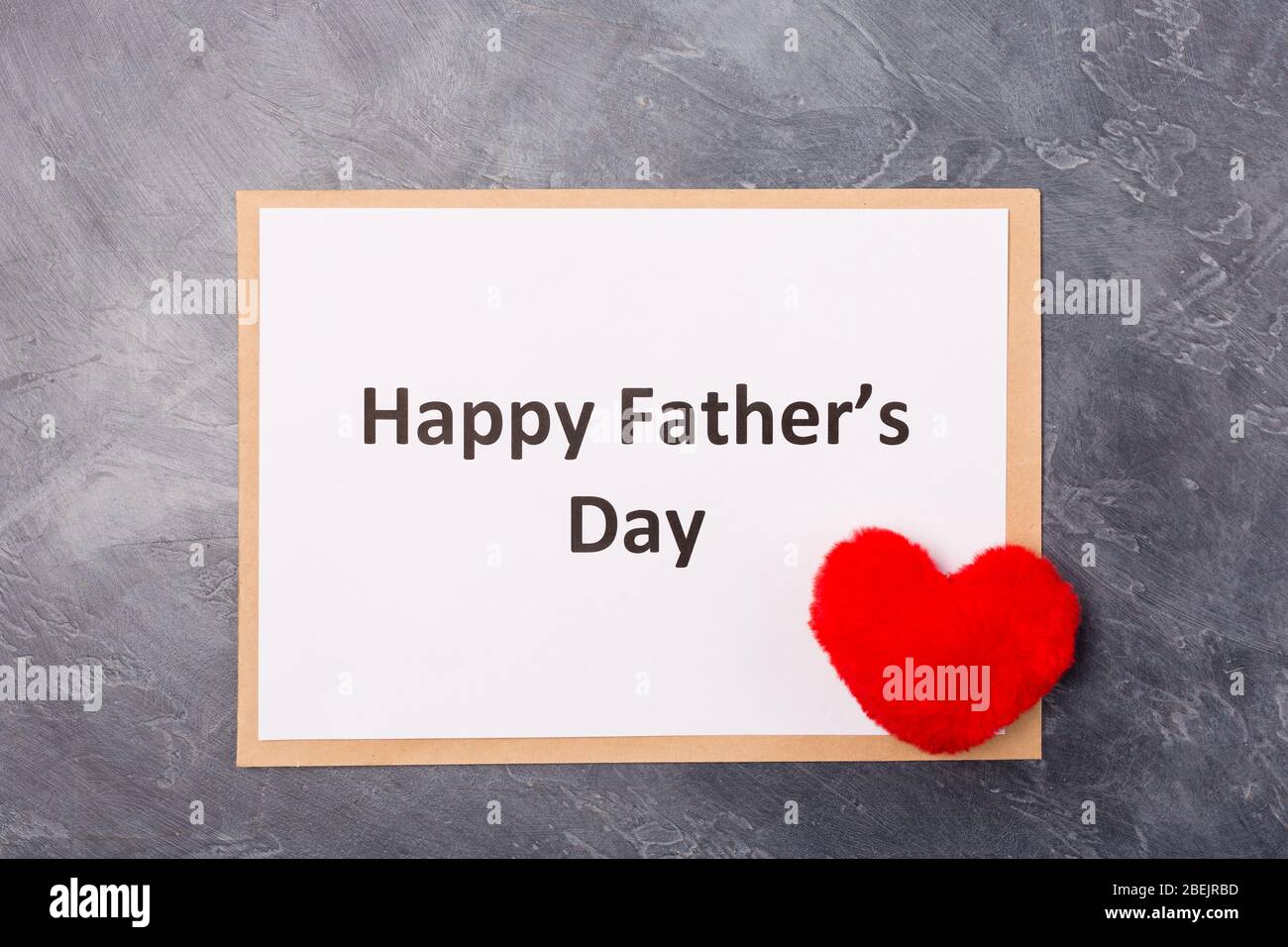 Happy Father's Day text on grey background with red heart. Free space. Space for text. Father's day holiday concept.  Stock Photo
