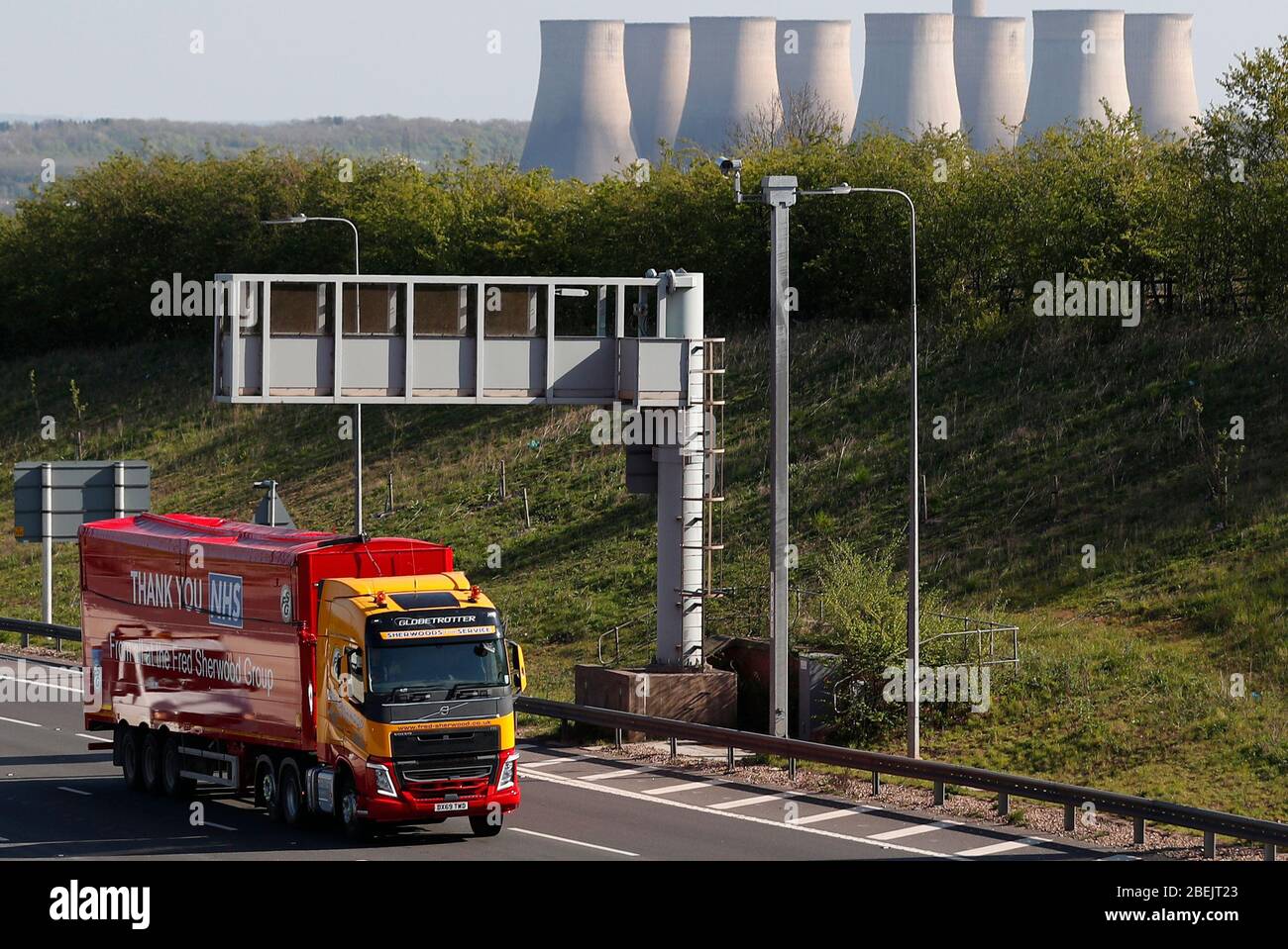 Kegworth, Leicestershire, UK. 14th April 2020.  A Fred Sherwood Group lorry sign written with a thank you message to the NHS is driven on the M1 motorway near Kegworth during the Coronavirus pandemic lockdown. Credit Darren Staples/Alamy Live News. Stock Photo