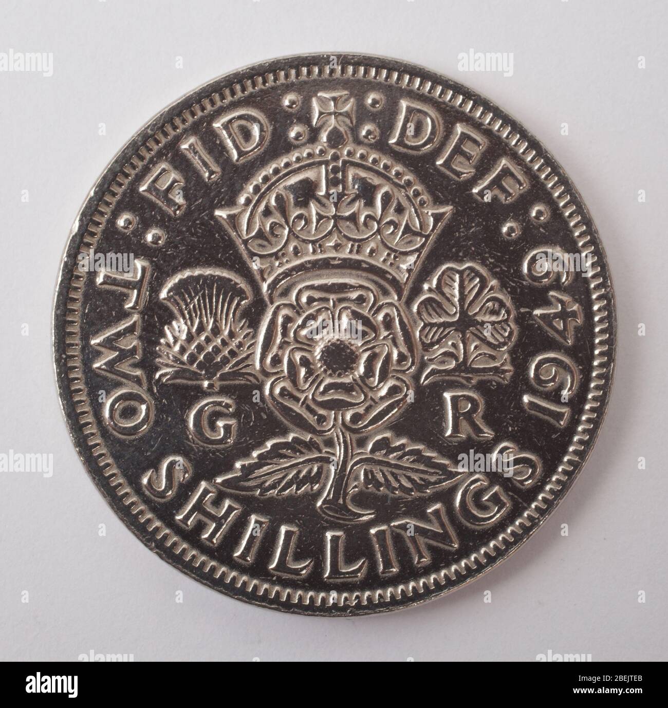 An English two shilling coin dated 1949 photographed against a white background Stock Photo