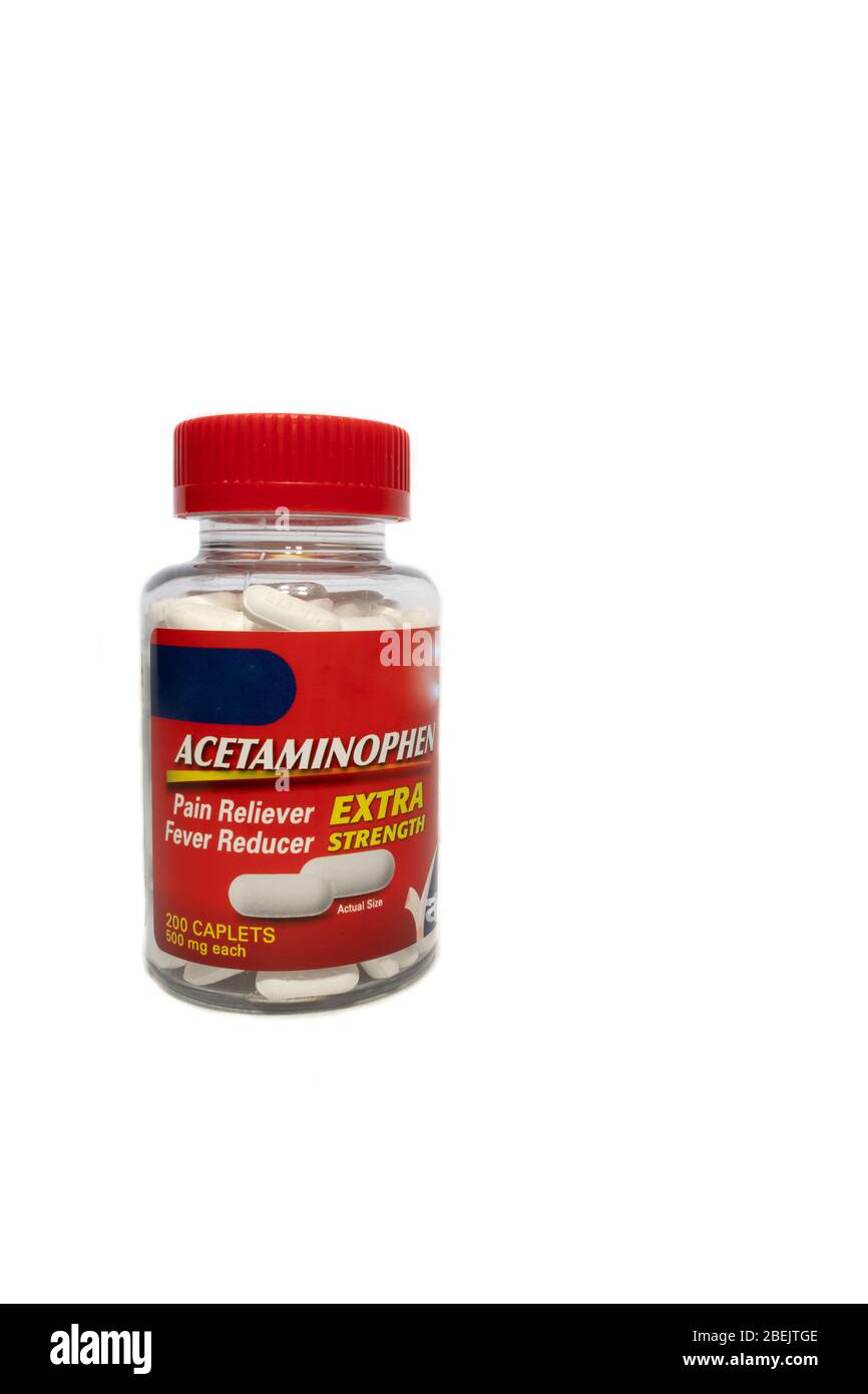 Red acetaminophen bottle full of pills on a white background Stock