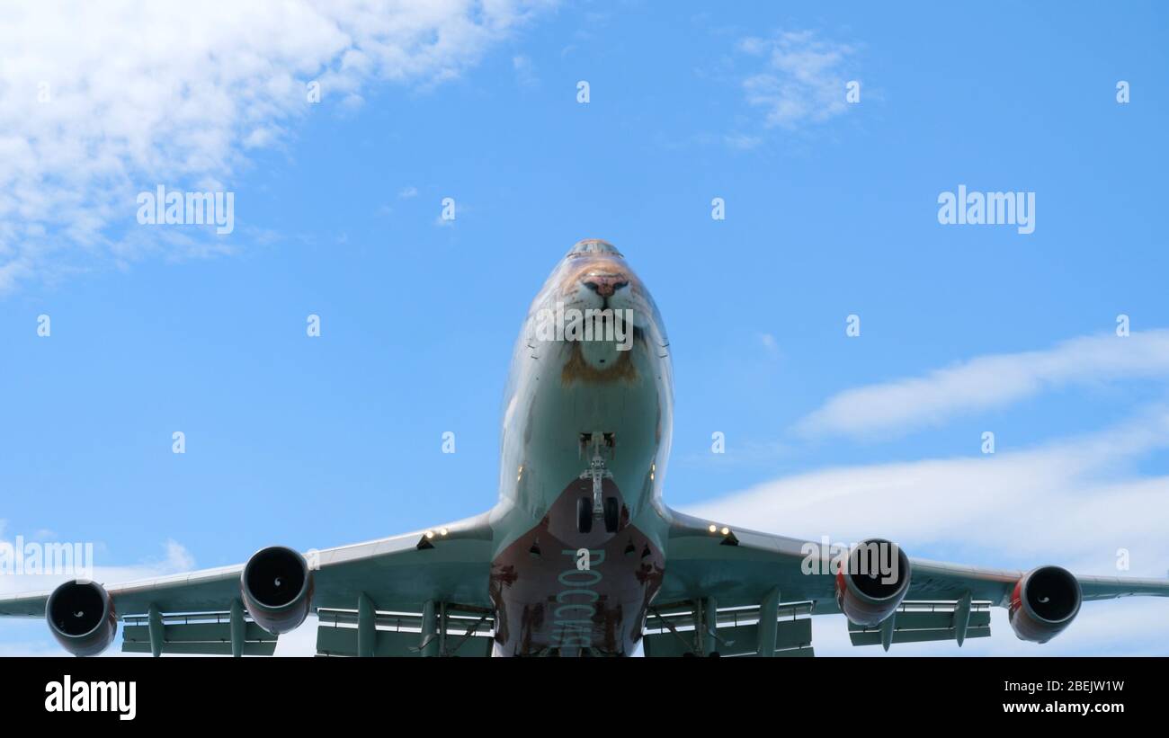 Airplane approaching before landing Stock Photo
