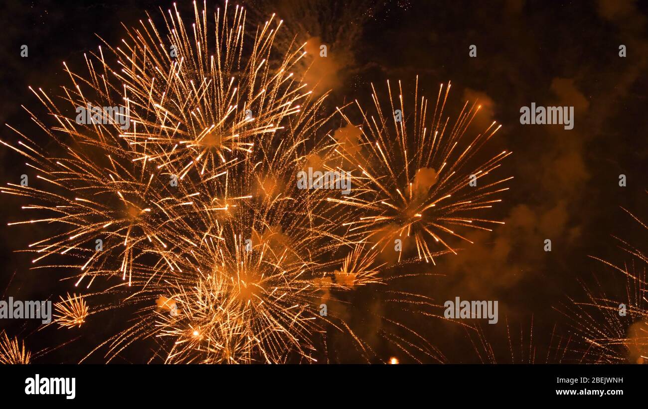 Bright fireworks in the night sky Stock Photo