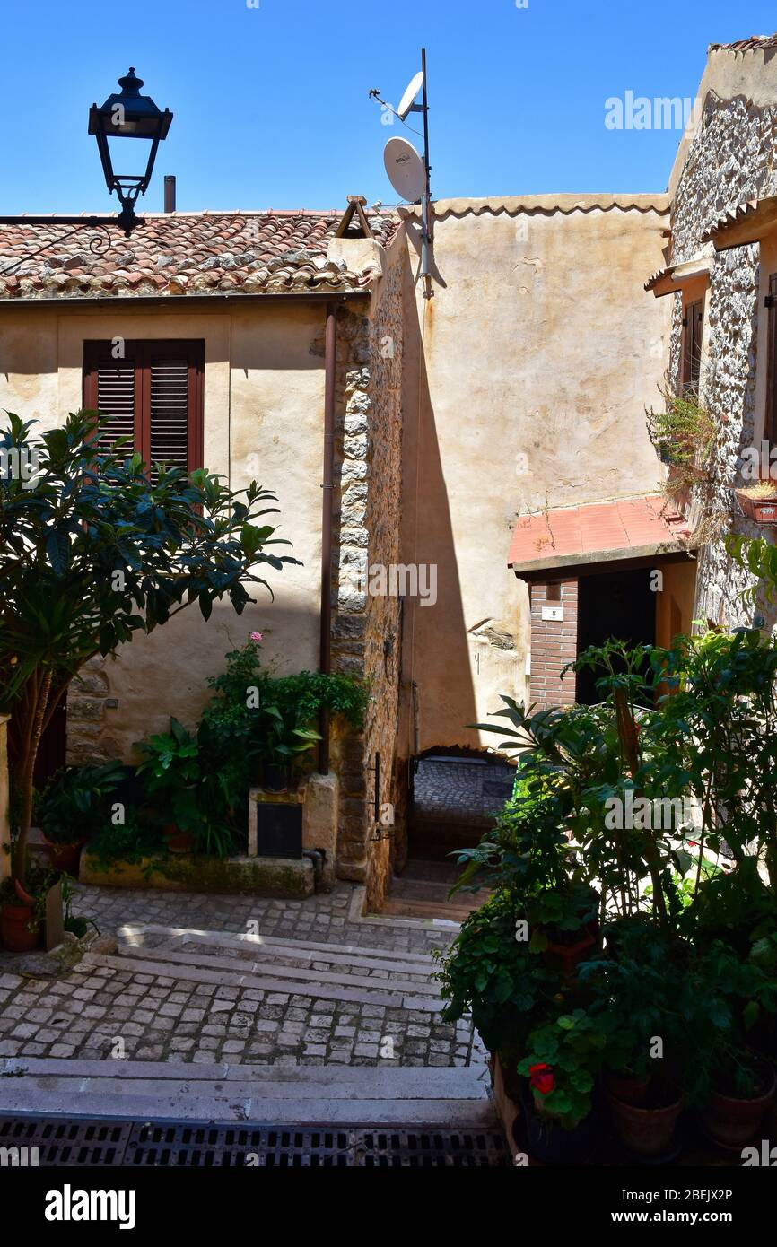 A narrow street between the old houses of Roccasecca dei Volsci, Italy Stock Photo