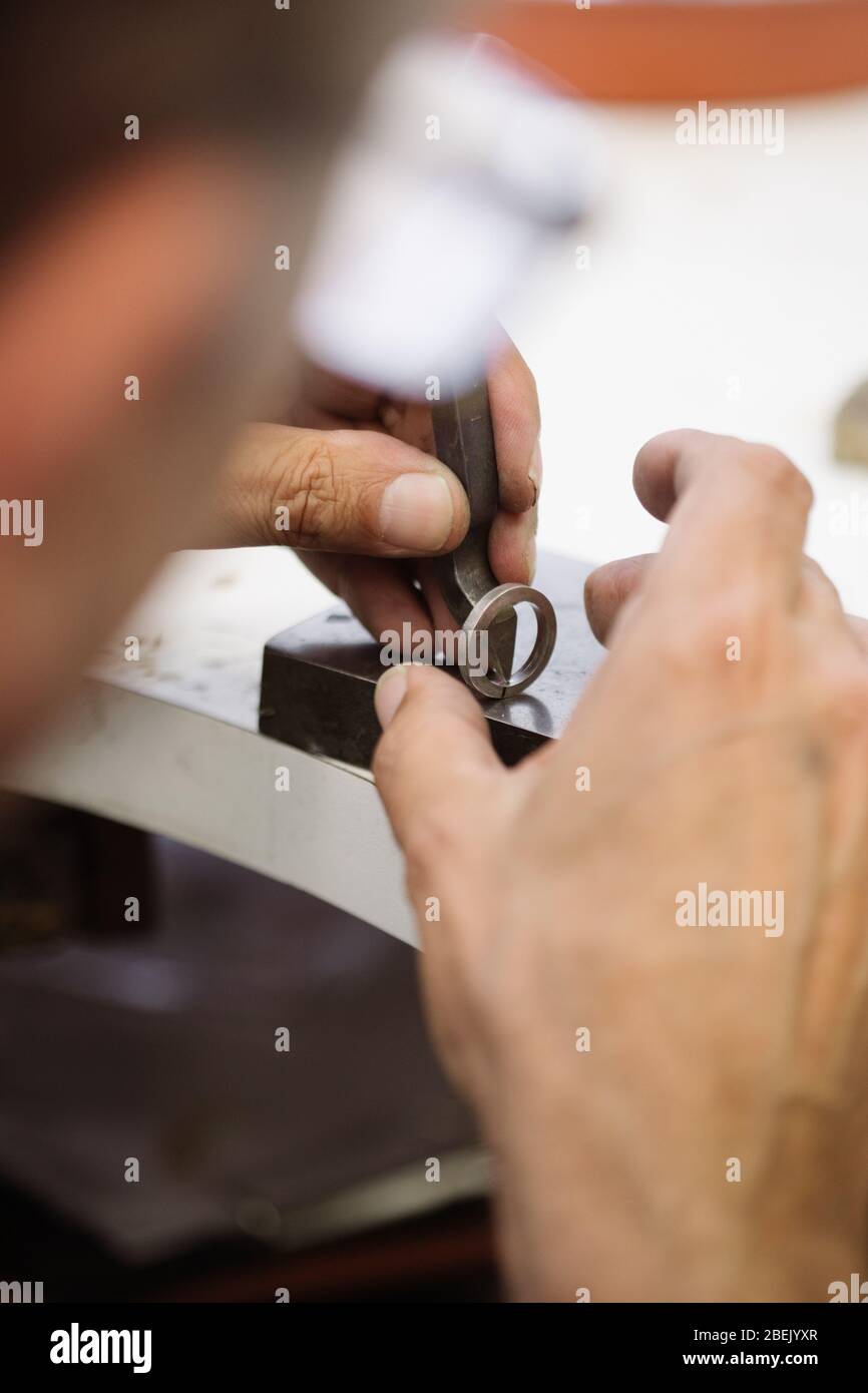 Jeweller engraving a ring Stock Photo Alamy