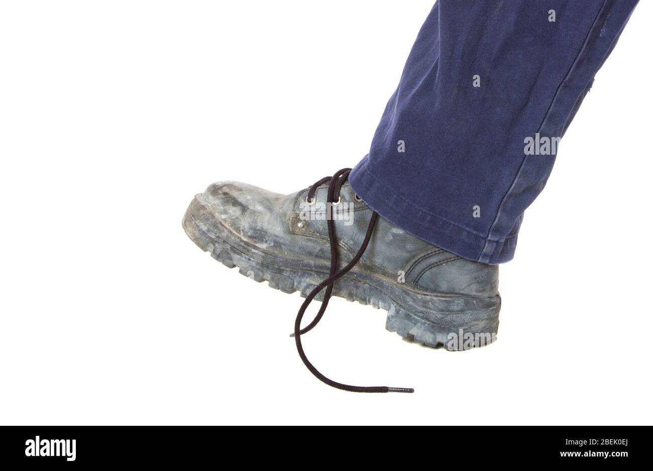 A tripping hazard with bootlace undone on white. Stock Photo