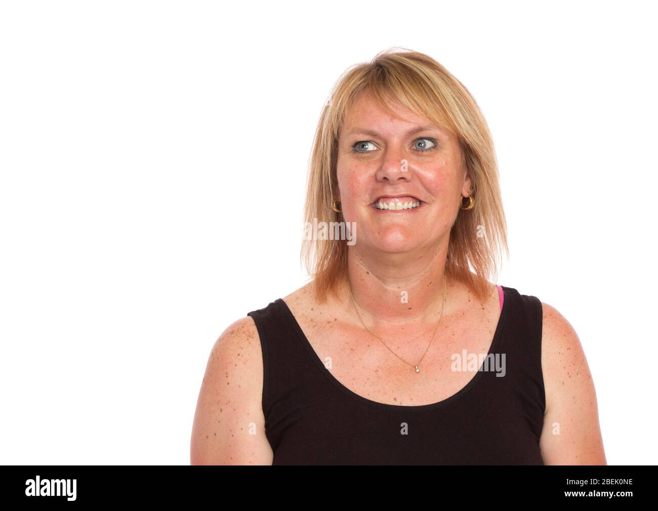 A normal attractive middle aged woman portrait on white. Stock Photo