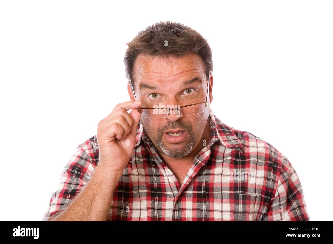 A guy in his forties looking over his eyeglasses Stock Photo
