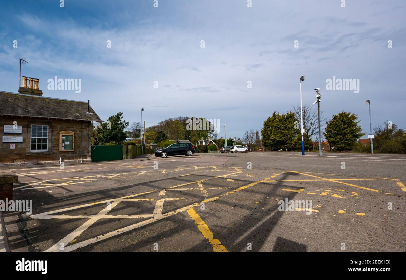 Drem, East Lothian, Scotland, United Kingdom, 14th April 2020. Covid-19 lockdown: on the first working day after the Easter bank holiday weekend, the rural train station carparks in a normally very busy commuter belt are almost empty. Drem railway station carpark is normally completely full on a weekday Stock Photo