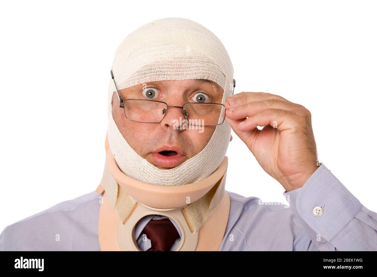 A traumatized man in neck brace and bandaged head. Stock Photo