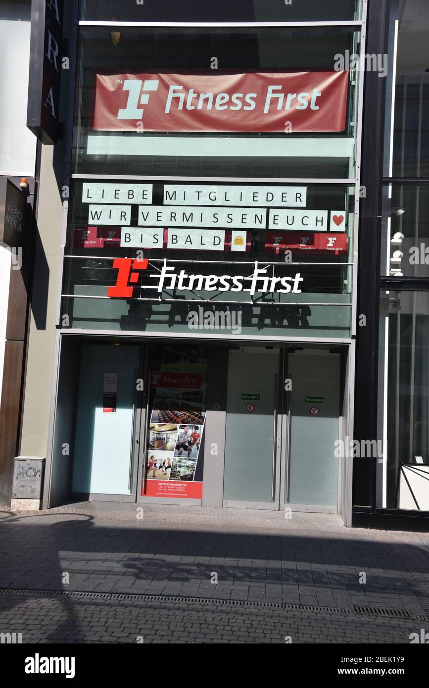 Cologne, Germany. 10th Apr, 2020. Sign at a branch of Fitness First, one of the world's largest