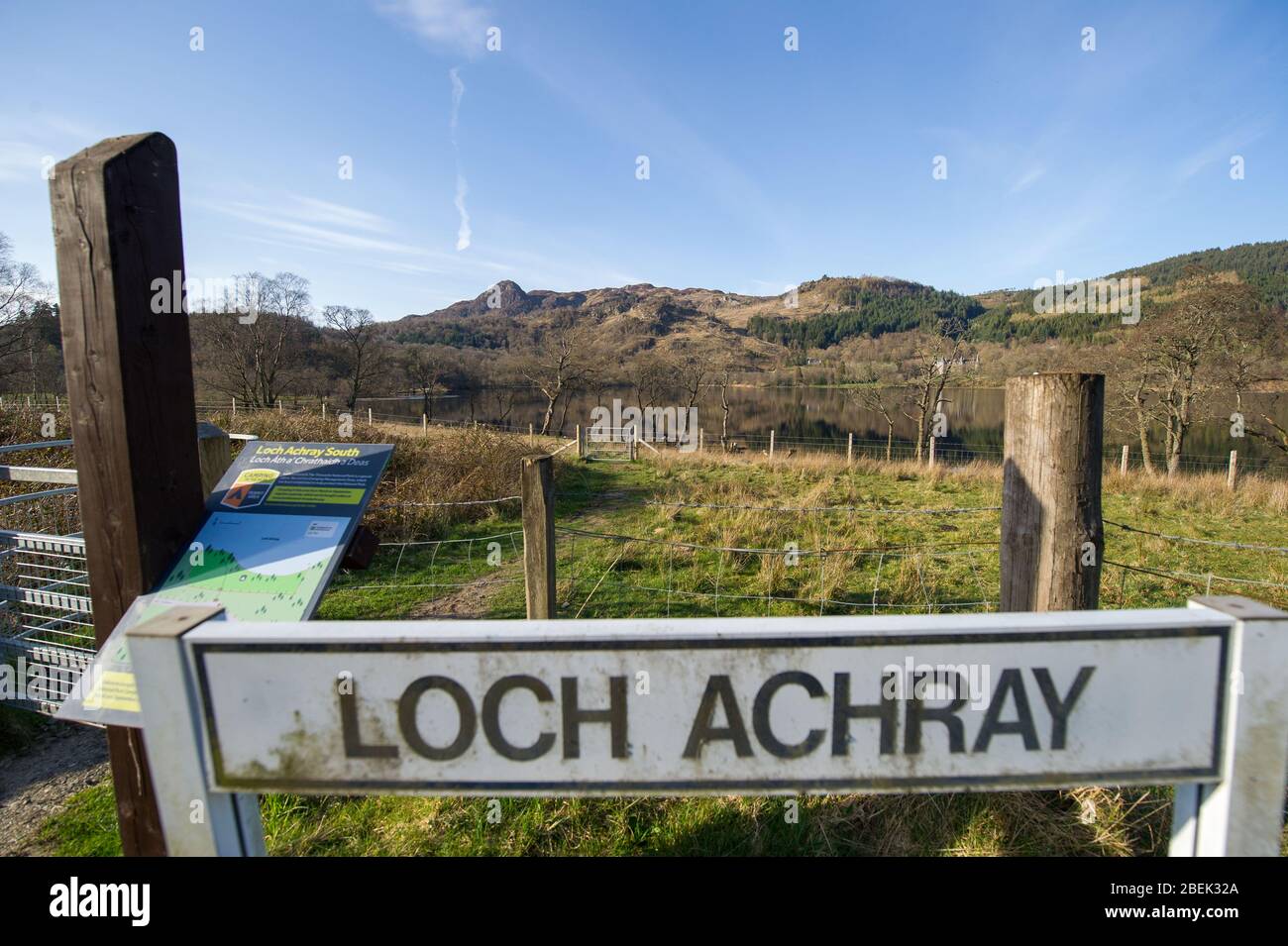 Loch Achray, UK. 13 April 2019.  Pictured: (Main pic) Loch Achray and camping site which is empty. (top left) Ben A’an mountain. Normally a tourist hot spot with hundreds of walkers, today not one walker found on the mountain top during a bright and hot sunny Spring Easter Monday.   Due to the UK wide Coronavirus (COVID-19) Lockdown imposed by both the UK and Scottish Governments, police have been enforcing the lockdown and people have been taking the warning seriously with all tourist and beauty hotspots being cordoned off with road blocks. Credit: Colin Fisher/Alamy Live News. Stock Photo