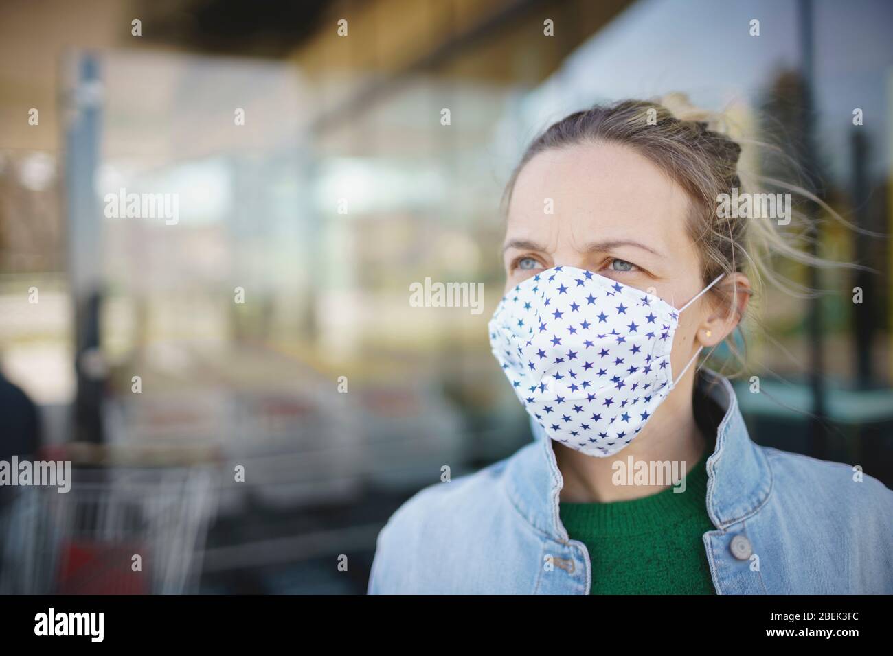 portrait of young woman wearing mouth face mask during covid 19 or ...