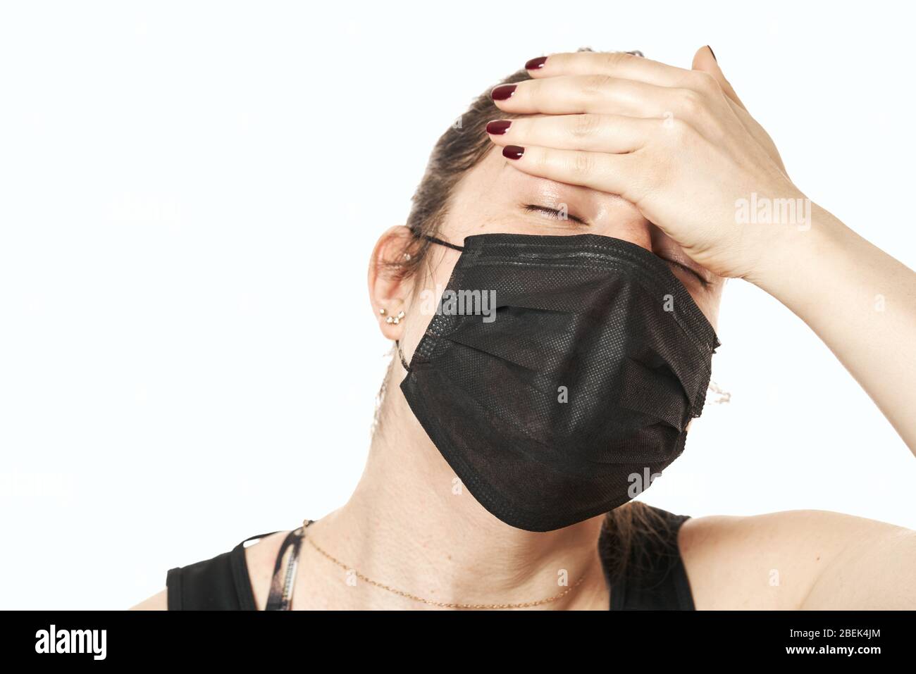 Worried, scare, panicked american woman in medical mask, concerned about viral pandemic illness, paranoid of pandemic. Stock Photo