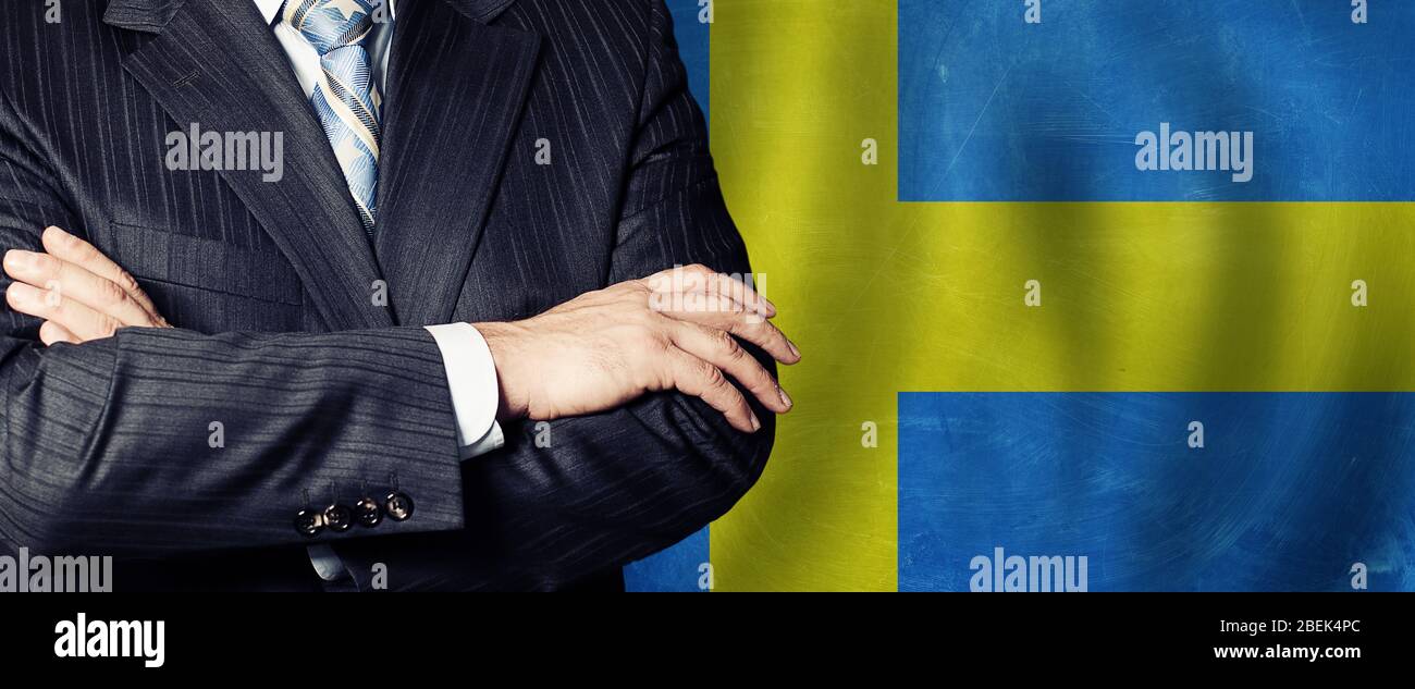 Male hands against Swedish flag background, business, politics and education in Sweden concept Stock Photo