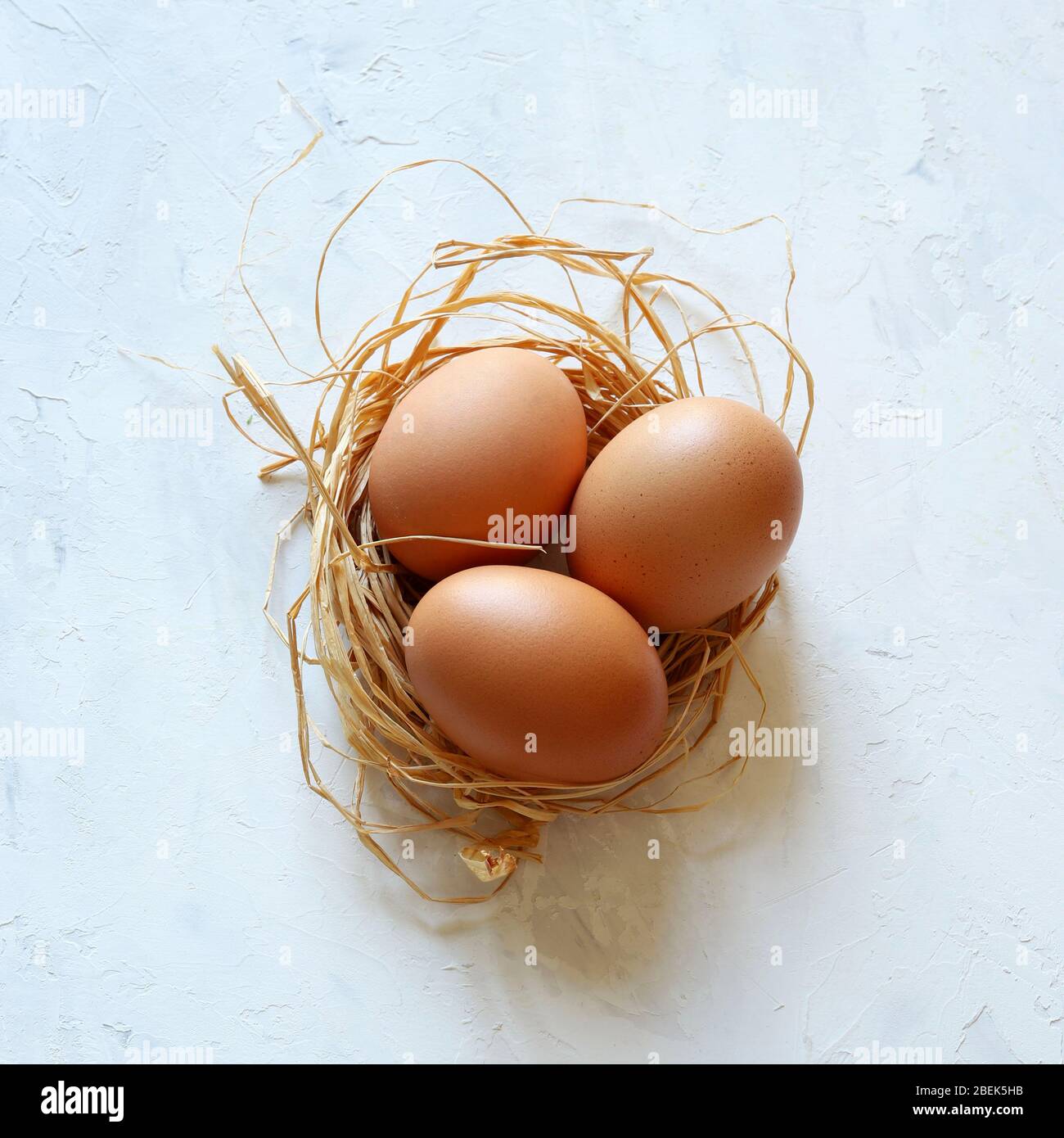 Healthy food concept. Three chicken eggs isolated on white background. Top view. Stock Photo