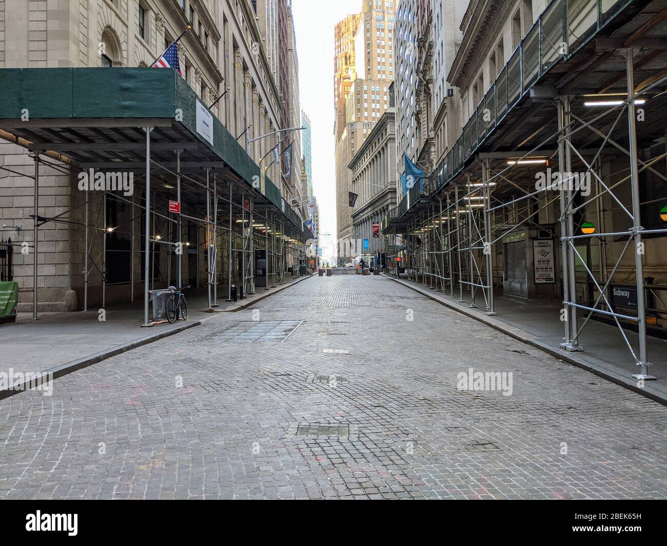 View of an empty Wall Street during the coronavirus pandemic in New  York City. Stock Photo