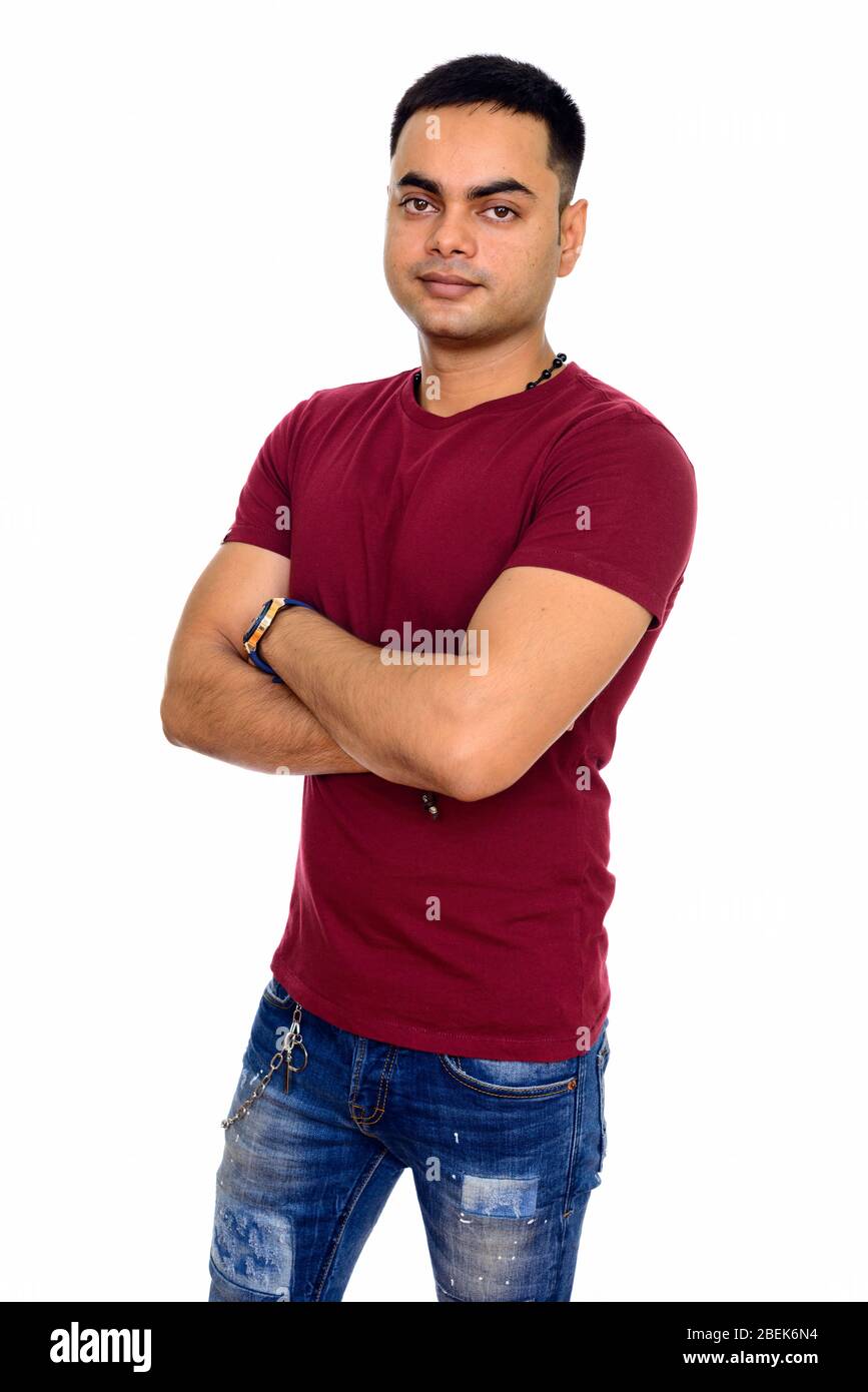 Portrait of young handsome Indian man with arms crossed Stock Photo - Alamy