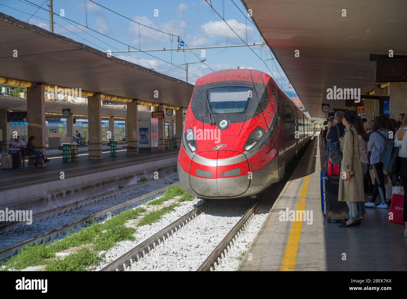 FLORENCE, ITALY - DECEMBER 25, 2017: Trenitalia Frecciarossa ETR 1000 high-speed passenger train arrives on the platform of the central railway statio Stock Photo