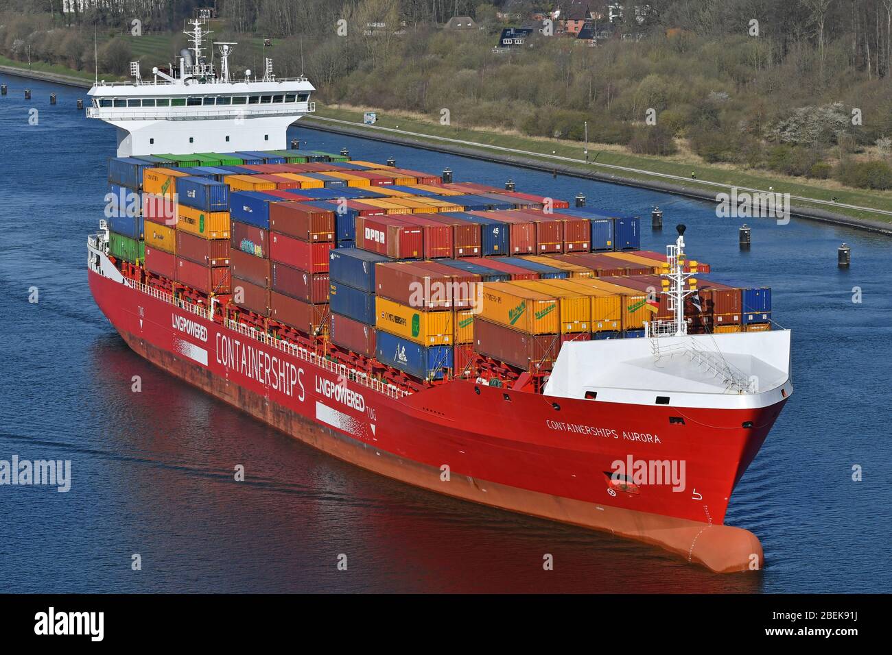 Containerships Aurora passing the Kiel Canal Stock Photo