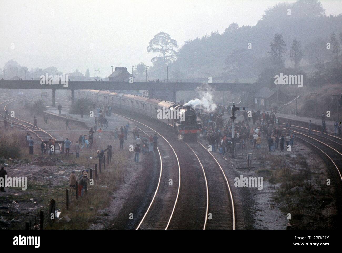 1975, train spotters watching a mainline steam train at Chinnley Edale, Northern England, UK Stock Photo