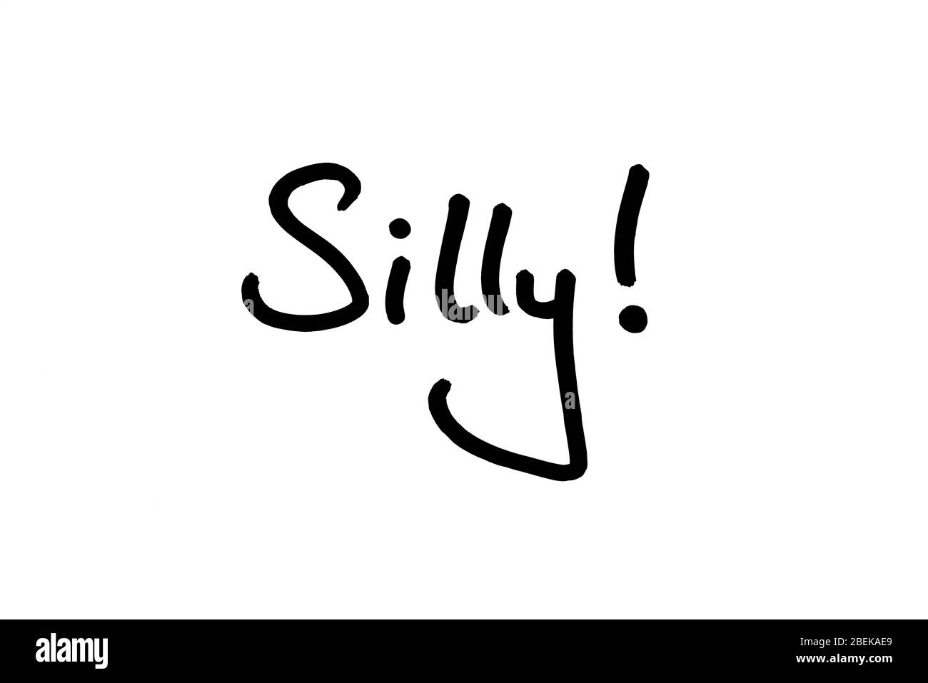 The word Silly! handwritten on a white background. Stock Photo
