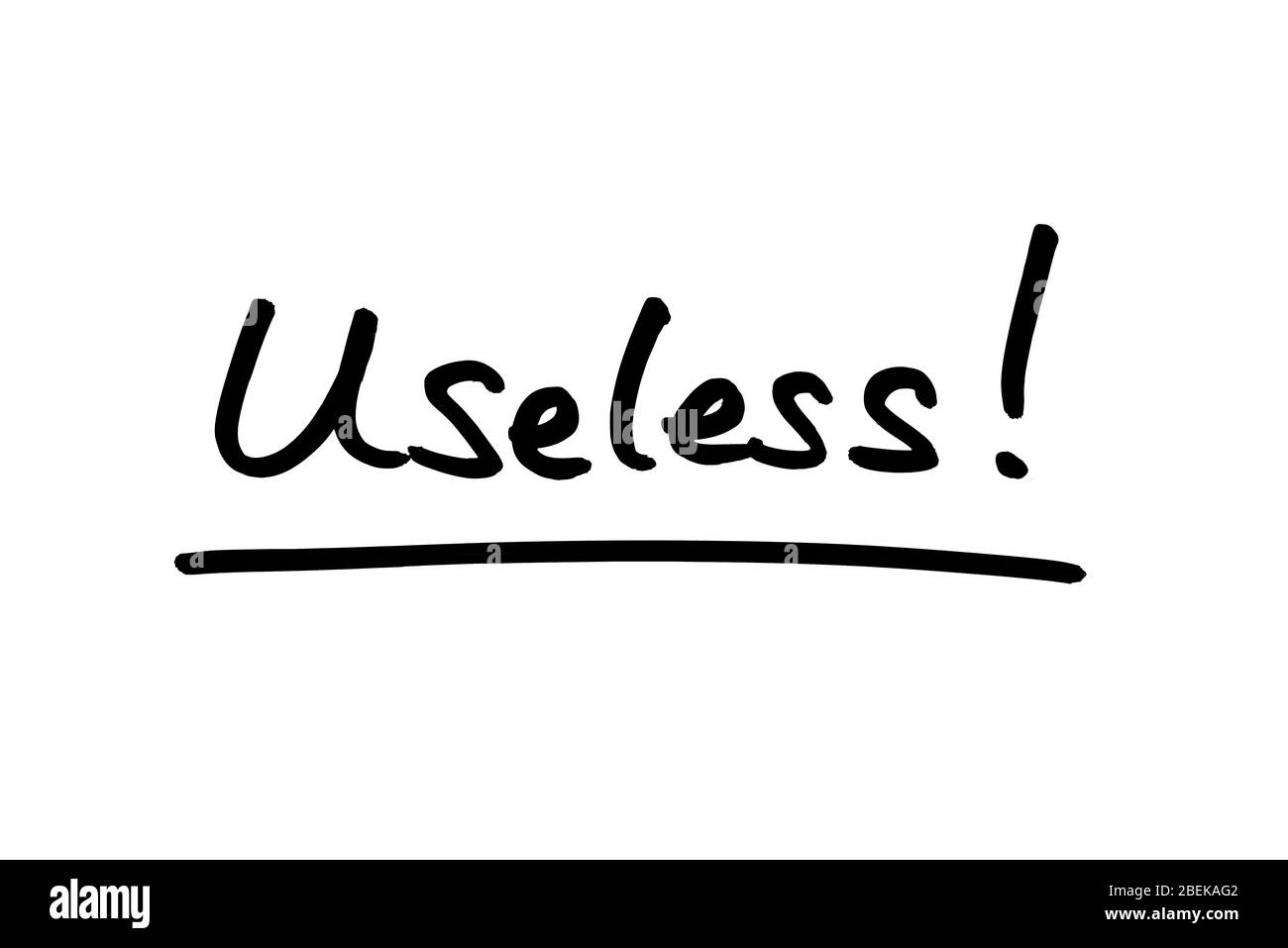 Useless! handwritten on a white background. Stock Photo