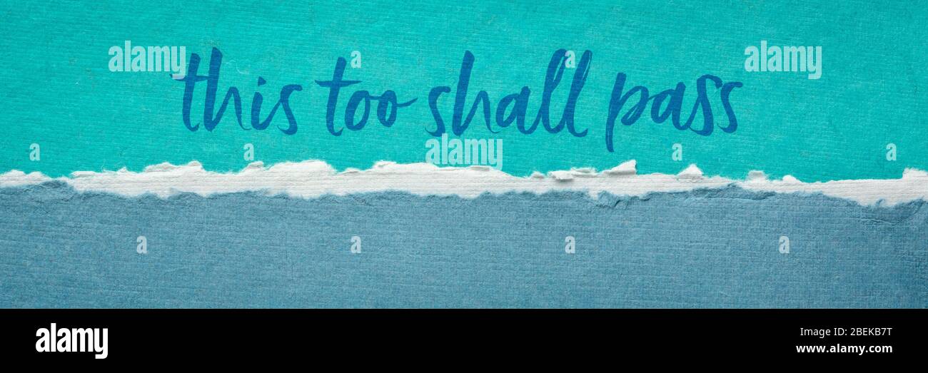this too shall pass - inspirational handwriting on a handmade paper, positivity, hope, temporary nature, or ephemerality of the human condition and si Stock Photo