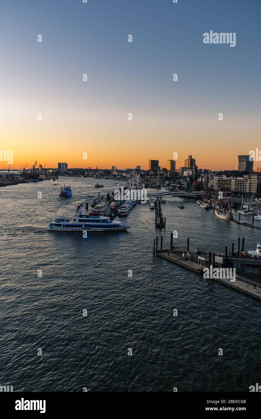 Panoramic view of the Port of Hamburg in the Hafen City at Elbe river at sunset/twilight Stock Photo