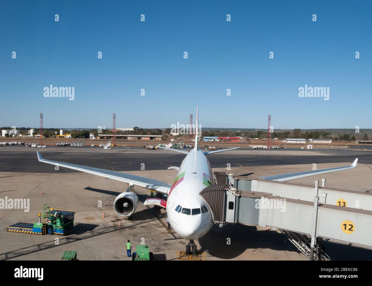 Brasilia, Brazil - August 8 2009: International Airport of Brasilia. Docked Airbus A330 of TAP airlines, boarding through carrier. Business and touris Stock Photo