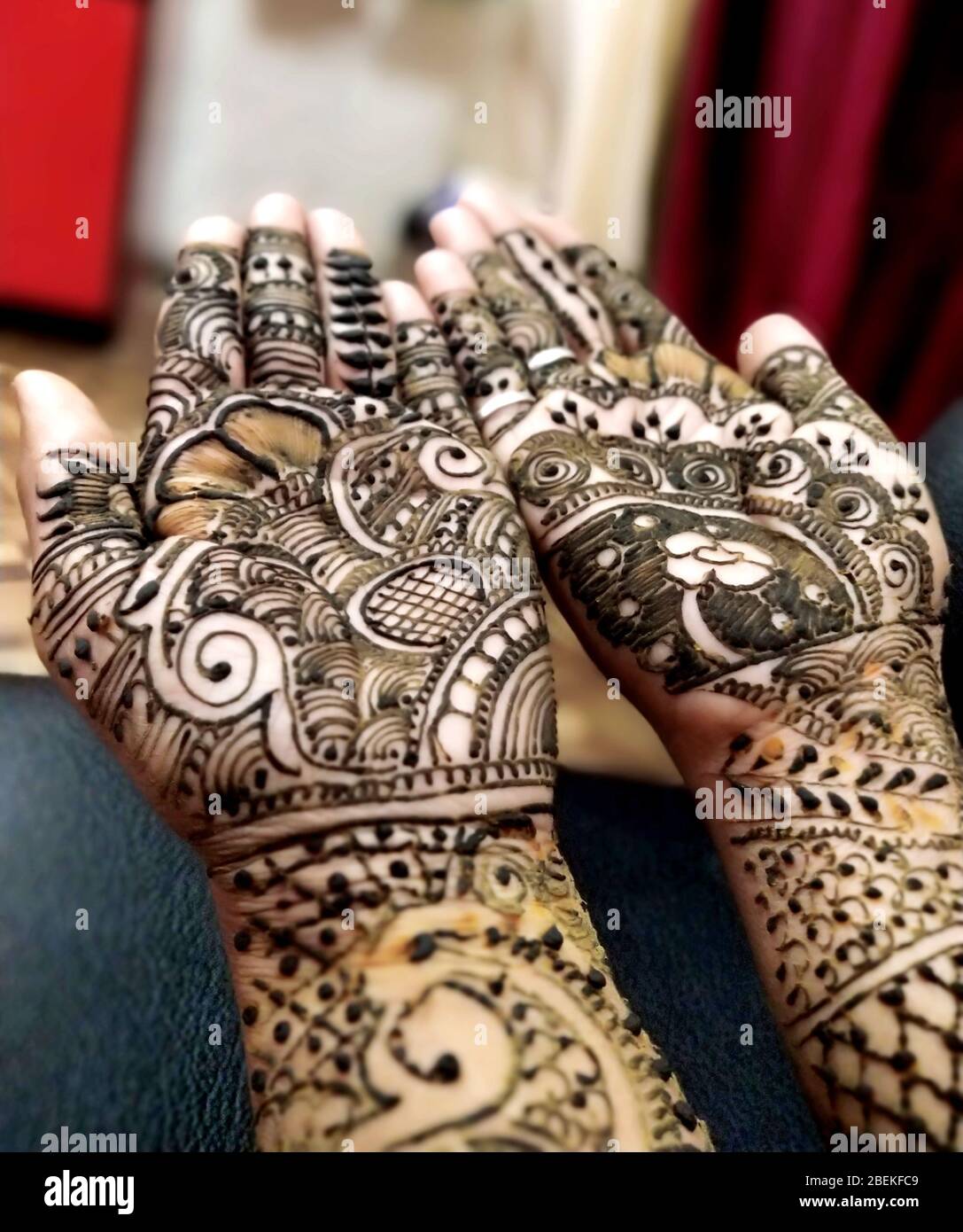 beautifully decorated indian hands with mehandi typically done for weddings Stock Photo