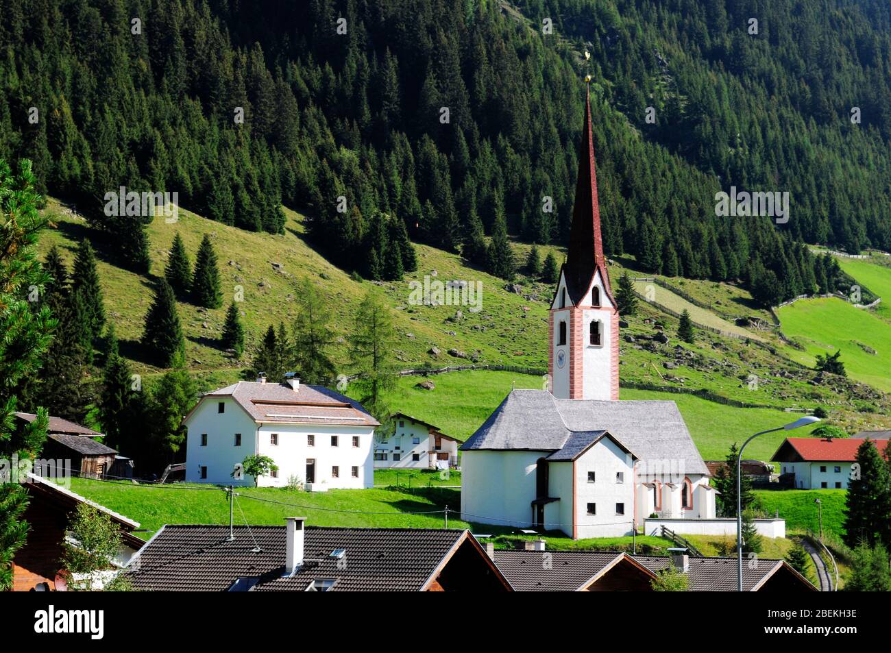 The small village with white church in Austria's mountains Stock Photo ...