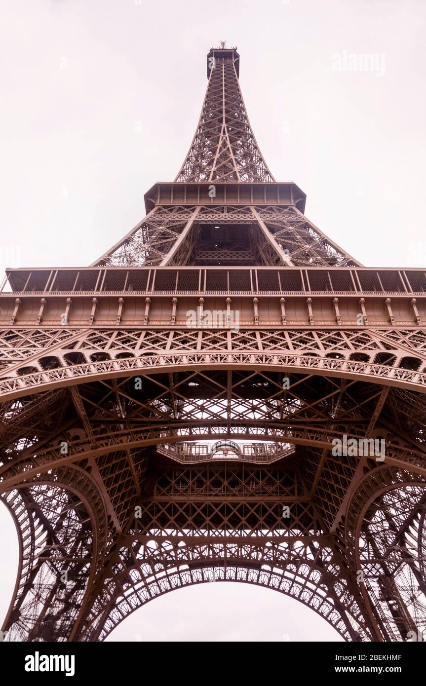 Eiffel Tower Brown, the bronze color painted in 1968, three shades to match the Parisian skyline; darker at the bottom becoming progressively lighter. Stock Photo