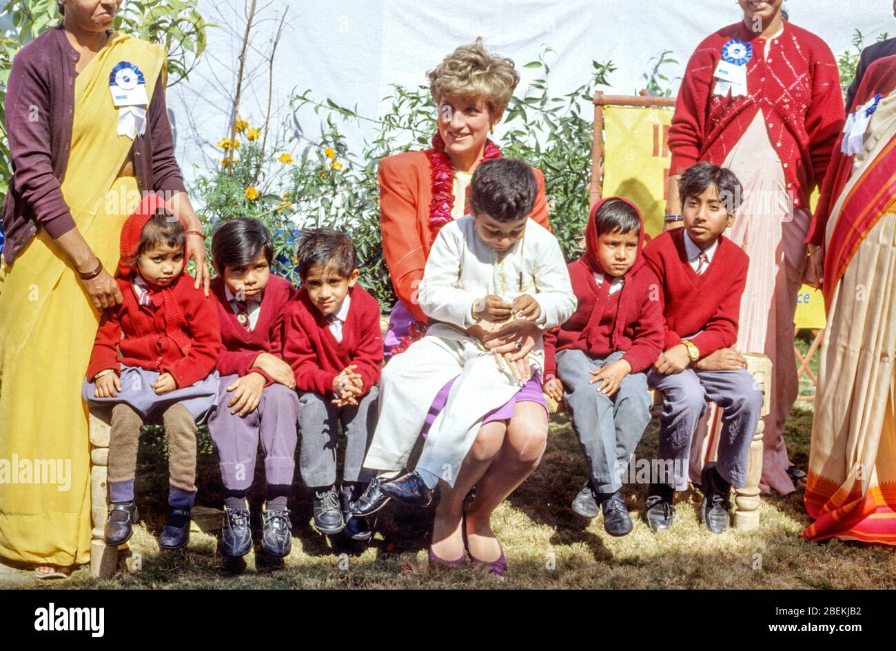 HRH Diana, Princess of Wales, wearing a Catherine Walker suit, chats to children during a visit to the Marie Stopes Clinic on February 11th 1992, Agra Stock Photo