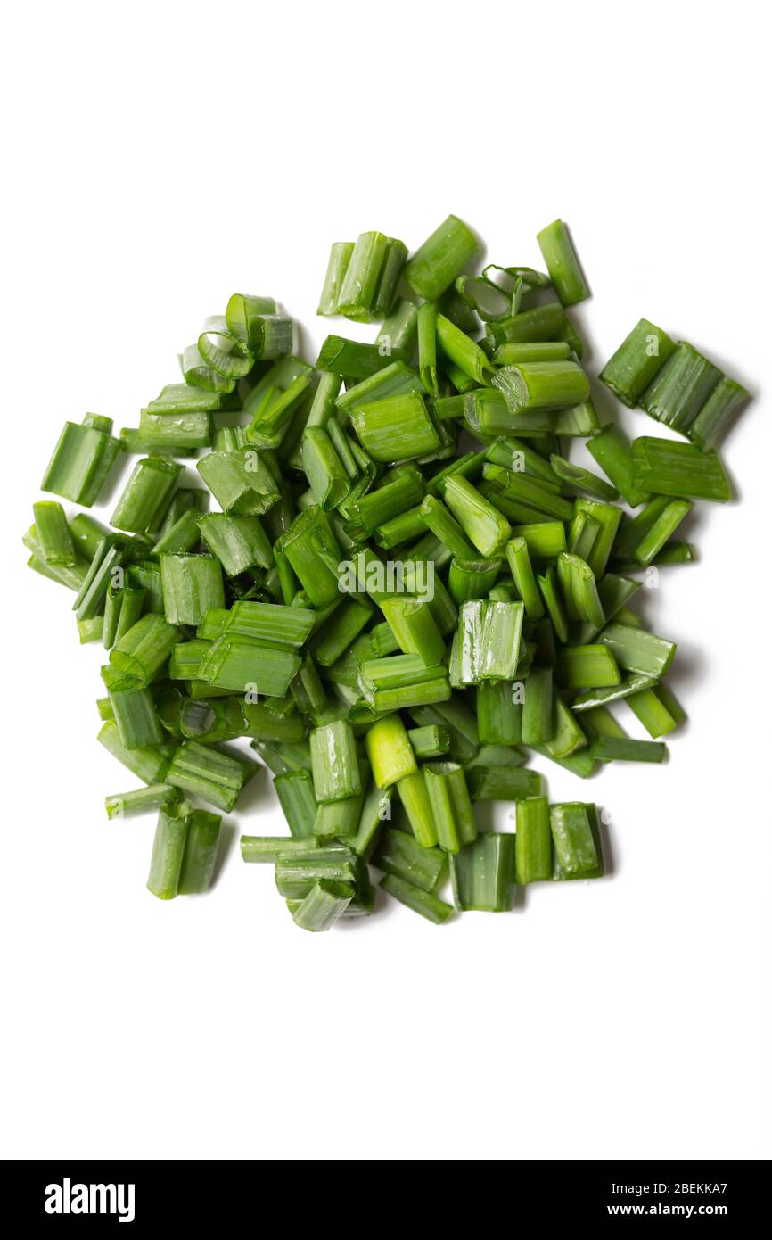 chopped green onions isolated on white background Stock Photo - Alamy