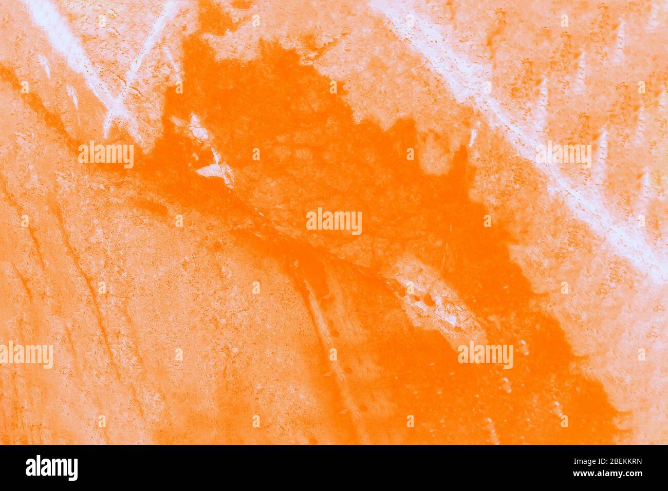 Macro shooting of mineral stone. Orange stone with white veins. Toned Stock Photo