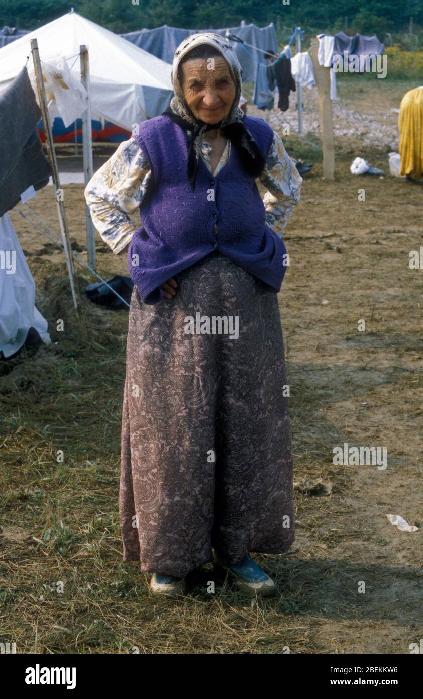 1995 Tuzla, Bosnia - Elderly female refugee at Tuzla airfield temporary UN refugee camp for Bosnian Muslims fleeing the Srebrenica Massacre during the Bosnian war. Stock Photo