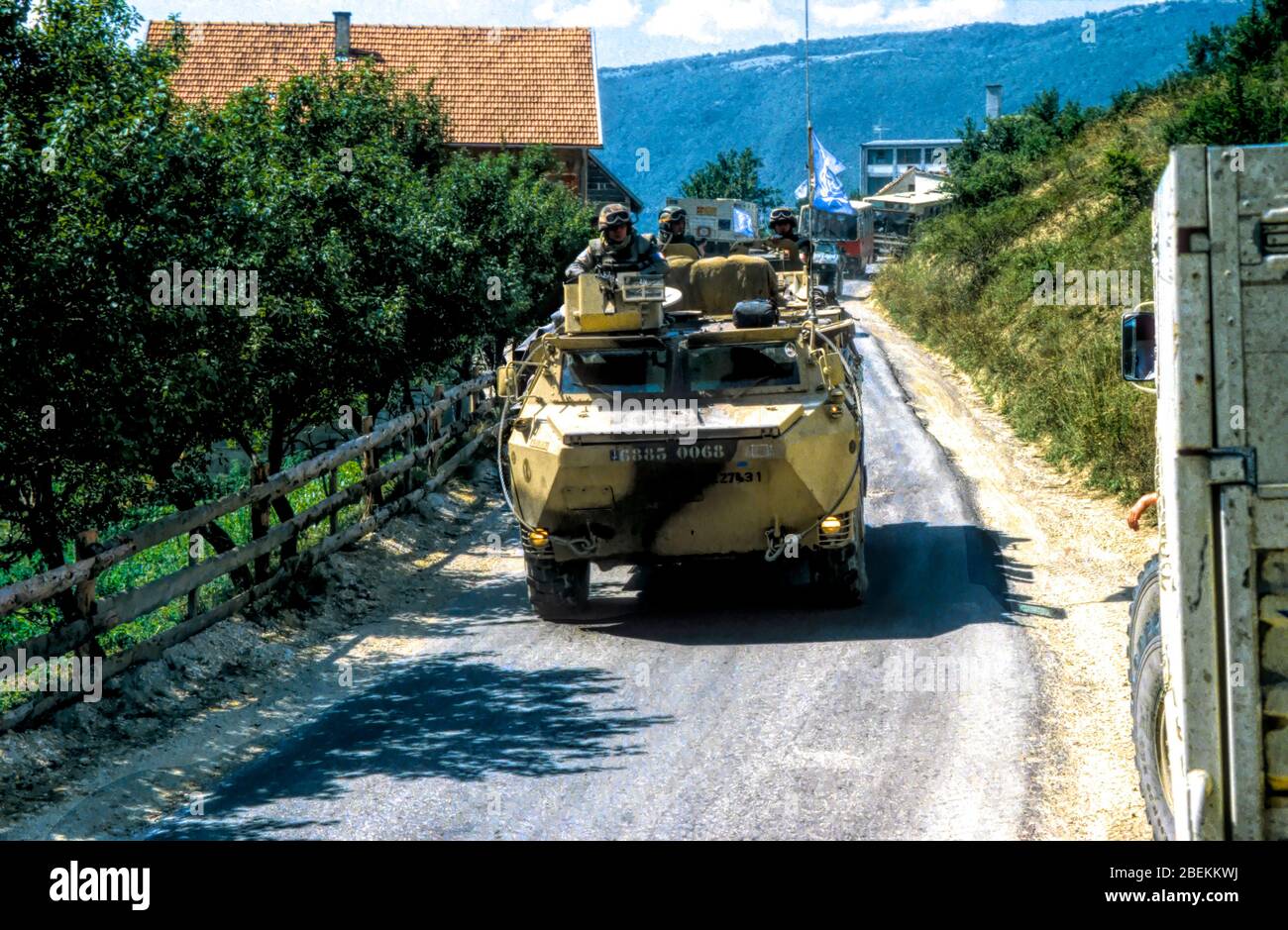 1993 Mostar, Bosnia - SFOR rapid response vehicle and soldiers patrolling the area of countryside near Mostar, Bosnia during the war Stock Photo