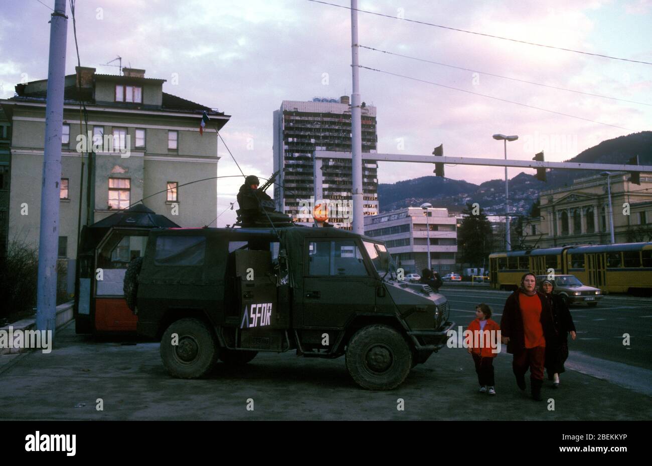 Sarajevo 1998 - SFOR soldiers observing movement on Meša Selimović Boulevard also known as 'Sniper alley' during the siege of Sarajevo, Bosnia Herzegovina Stock Photo