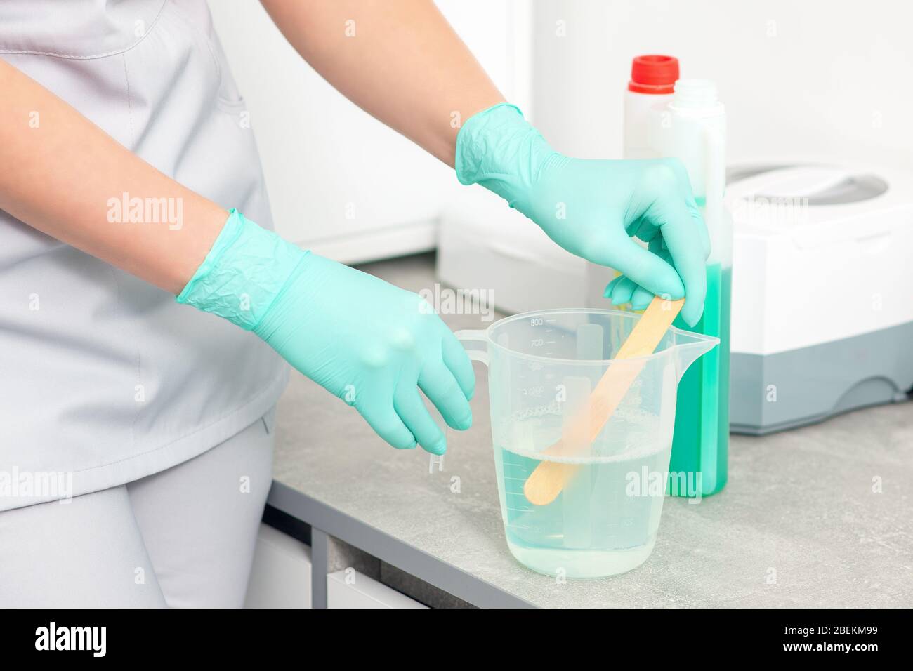 Medical worker hands is preparing solution for ultrasonic disinfect