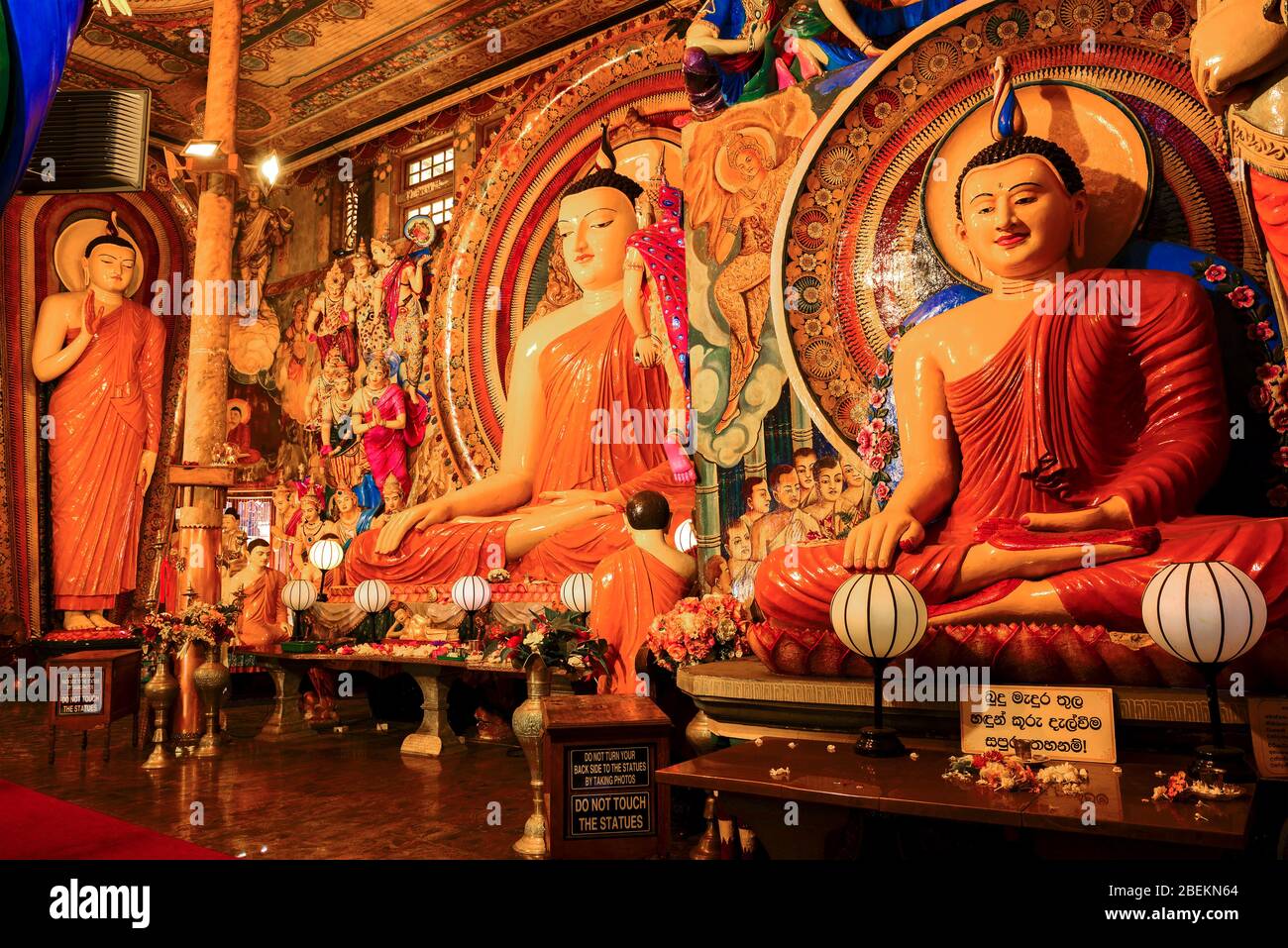 COLOMBO, SRI LANKA - FEBRUARY 22, 2020: Three Buddha sculptures in Gangaramaya Temple. Stock Photo